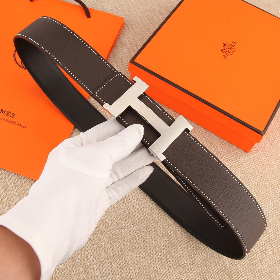 Hermes belt in dark brown leather with silver-tone H buckle and white contrast stitching