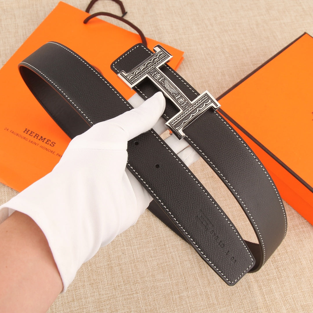 Leather belt with silver-tone H buckle and multiple adjustment holes, white stitching