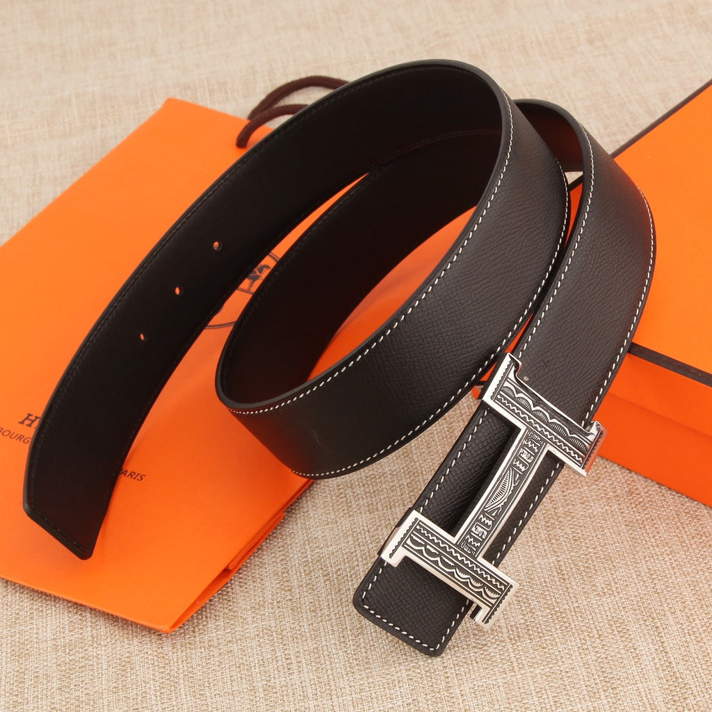 Leather belt with dark leather straps, silver-tone buckle, and white contrast stitching