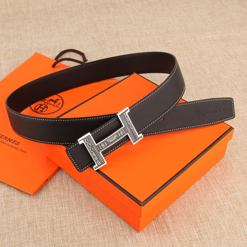 Leather belt with silver-tone H buckle and keeper loop, dark leather with white stitching