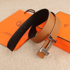 Hermes belt set view: black strap and tan strap with silver-tone H buckle.