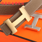 Hermes belt close-up: dark brown textured leather and silver H buckle, stitched edges