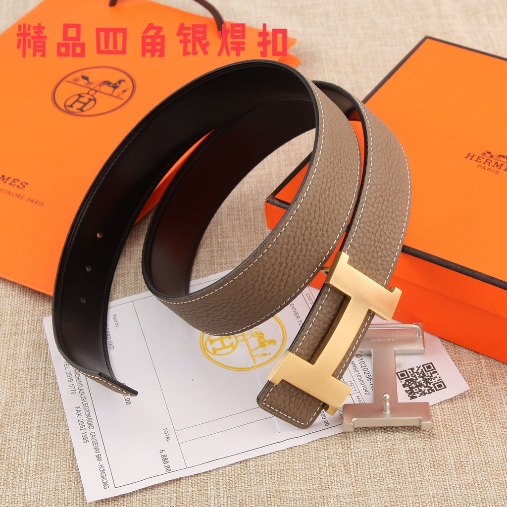 Hermes belt with dark brown strap, silver H buckle, and black underside