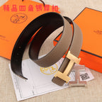 Hermes belt with dark brown strap, silver H buckle, and black underside
