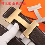 Gold-tone H-style belt buckle with brown leather strap and white contrast stitching.