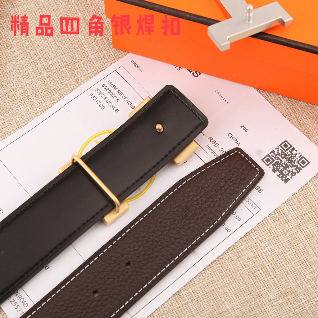 Brown leather belt underside with gold-tone buckle hardware and white contrast stitching.