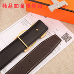 Brown leather belt underside with gold-tone buckle hardware and white contrast stitching.