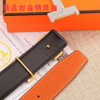 Hermes leather belt end section: black interior strap and orange stitched panel
