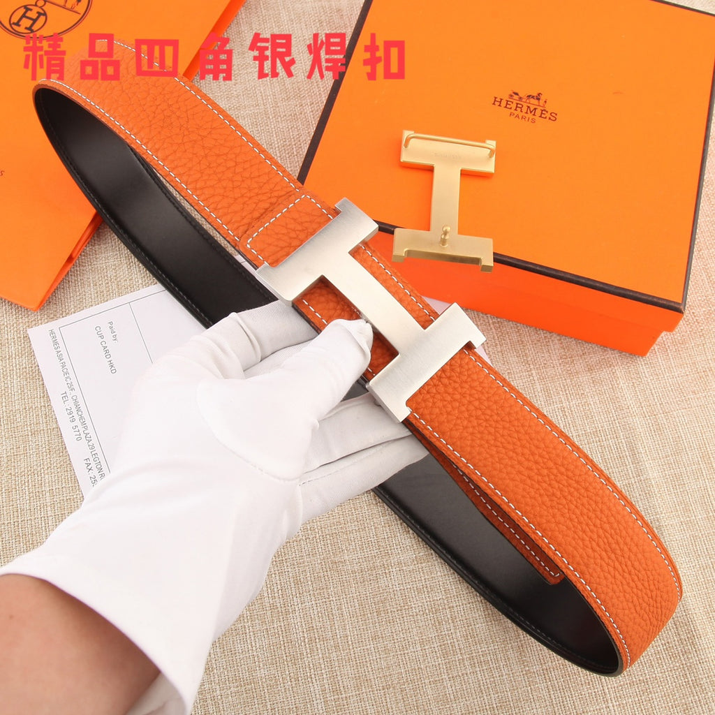 Hermes leather belt with orange textured strap and silver H buckle