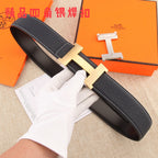 Black pebbled leather belt with gold-tone H buckle and white contrast stitching
