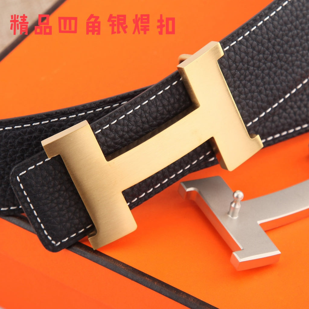 Black leather belt with gold-tone H buckle close-up and white topstitching