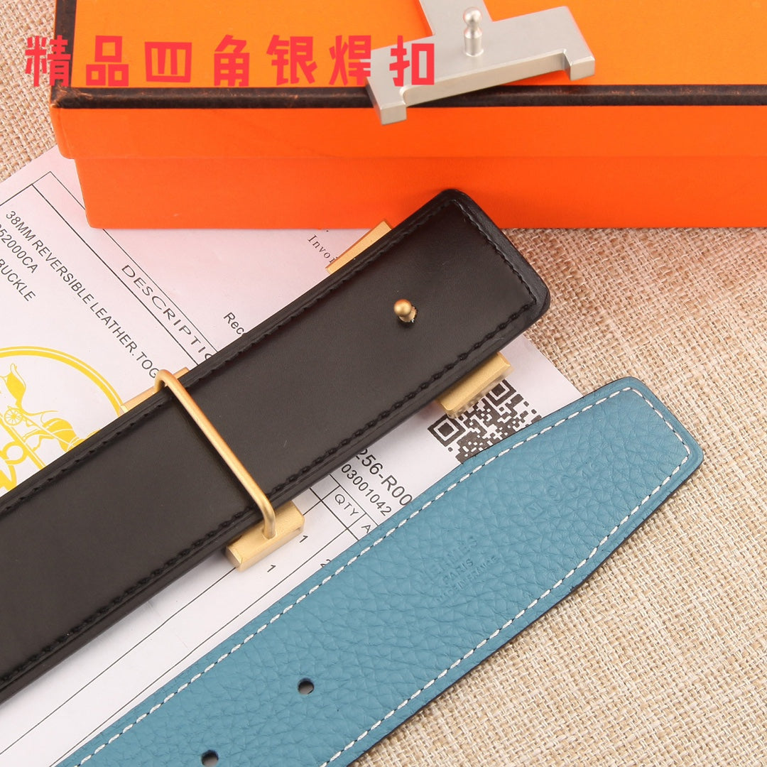 Hermes belt end view: black leather underside, blue strap, metal H buckle and hole button