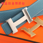 Hermes belt close-up: blue textured strap with white stitching and metal H buckle