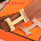 Hermes leather belt buckle with gold-tone H clasp and brown strap with white stitching.