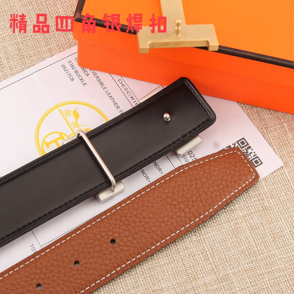 Hermes leather belt end with brown strap, gold-tone buckle, and black keeper panel.