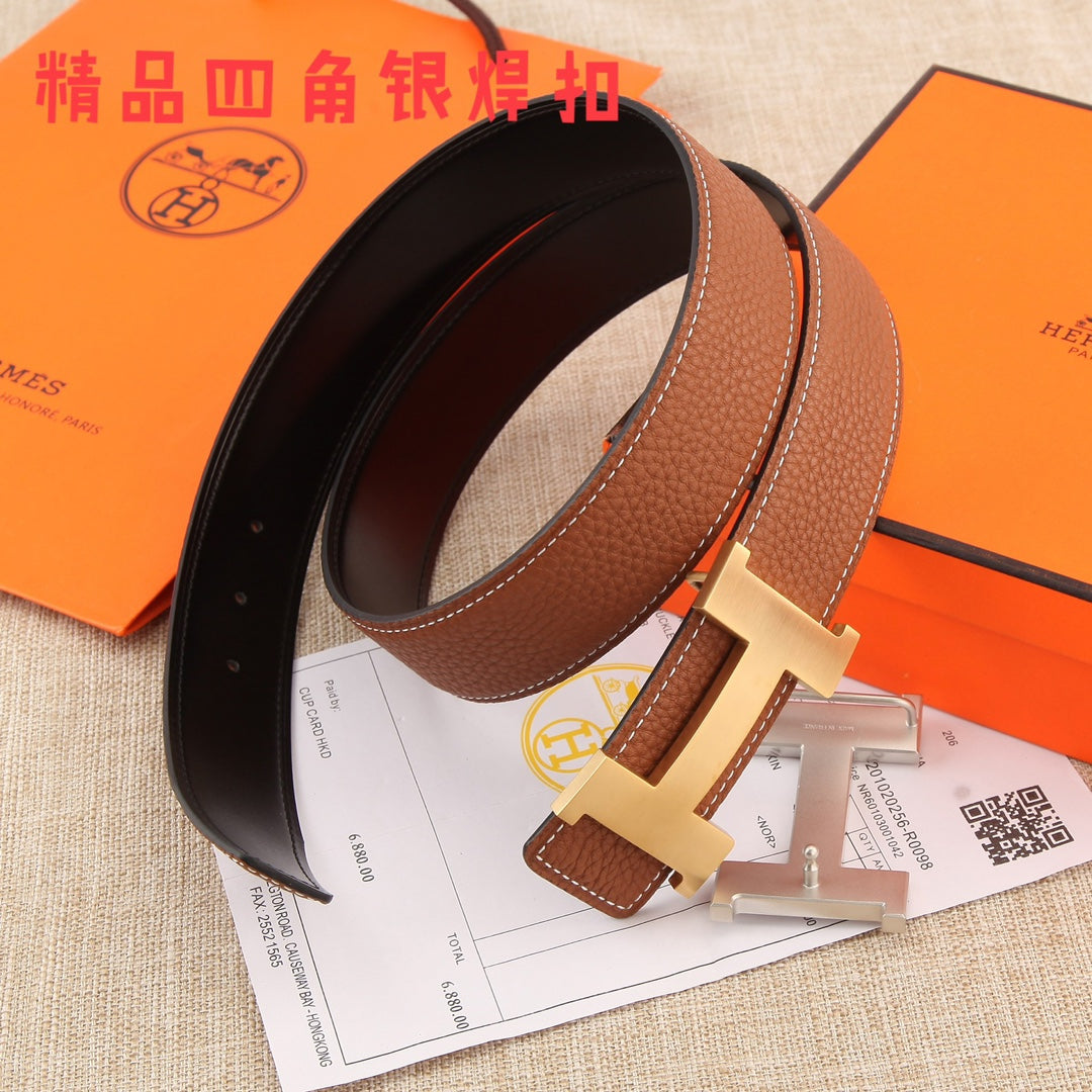 Hermes leather belt, brown strap with gold-tone H buckle and black inner backing.