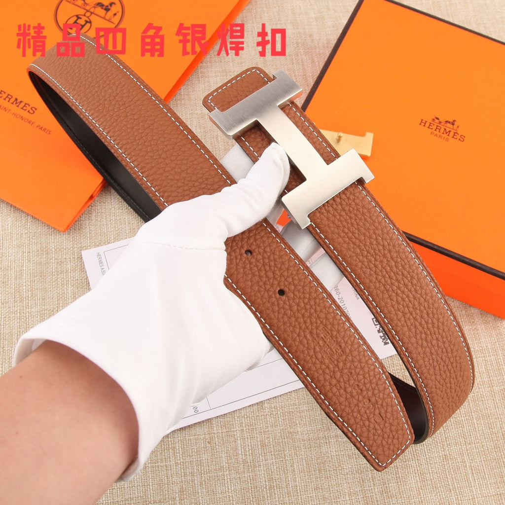 Hermes leather belt with brown strap and gold-tone H buckle, with visible belt holes.