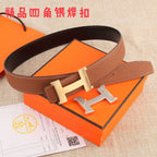 Hermes leather belt with brown strap and gold-tone H buckle, shown flat.