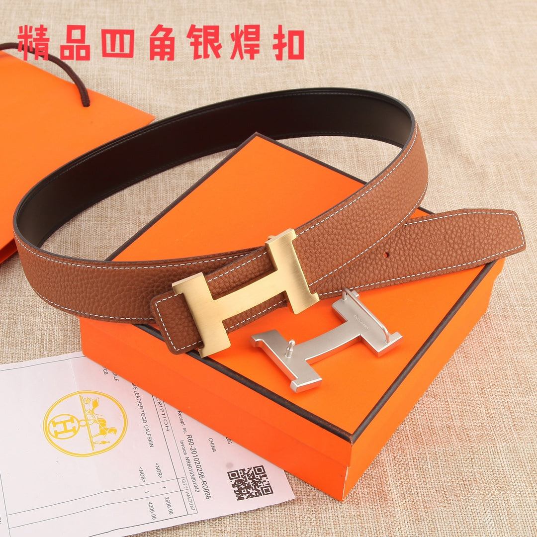 Hermes leather belt with brown strap and gold-tone H buckle, shown flat.