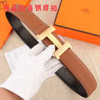 Hermes leather belt with brown textured strap and gold-tone H buckle, stitched edges.