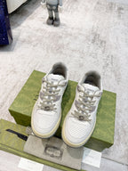 Gucci unisex sneakers pair, white with perforated toe, lace-up, and beige rubber sole