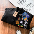 Black bomber jacket collar with embroidered front patches