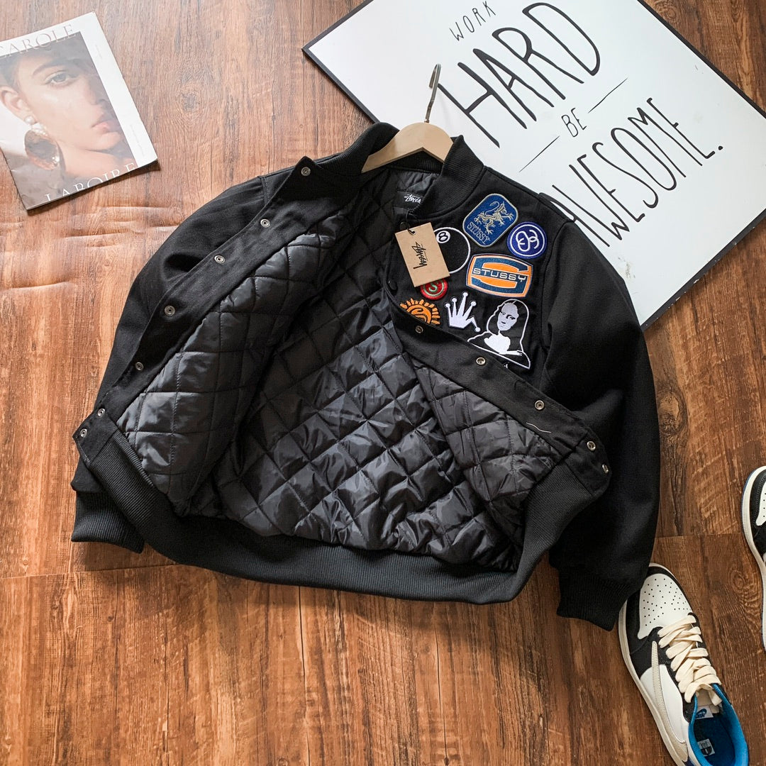 Black bomber jacket with quilted lining and snap front