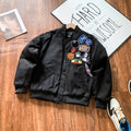 Black bomber jacket with embroidered patches on front