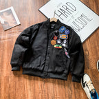 Black bomber jacket with embroidered patches on front
