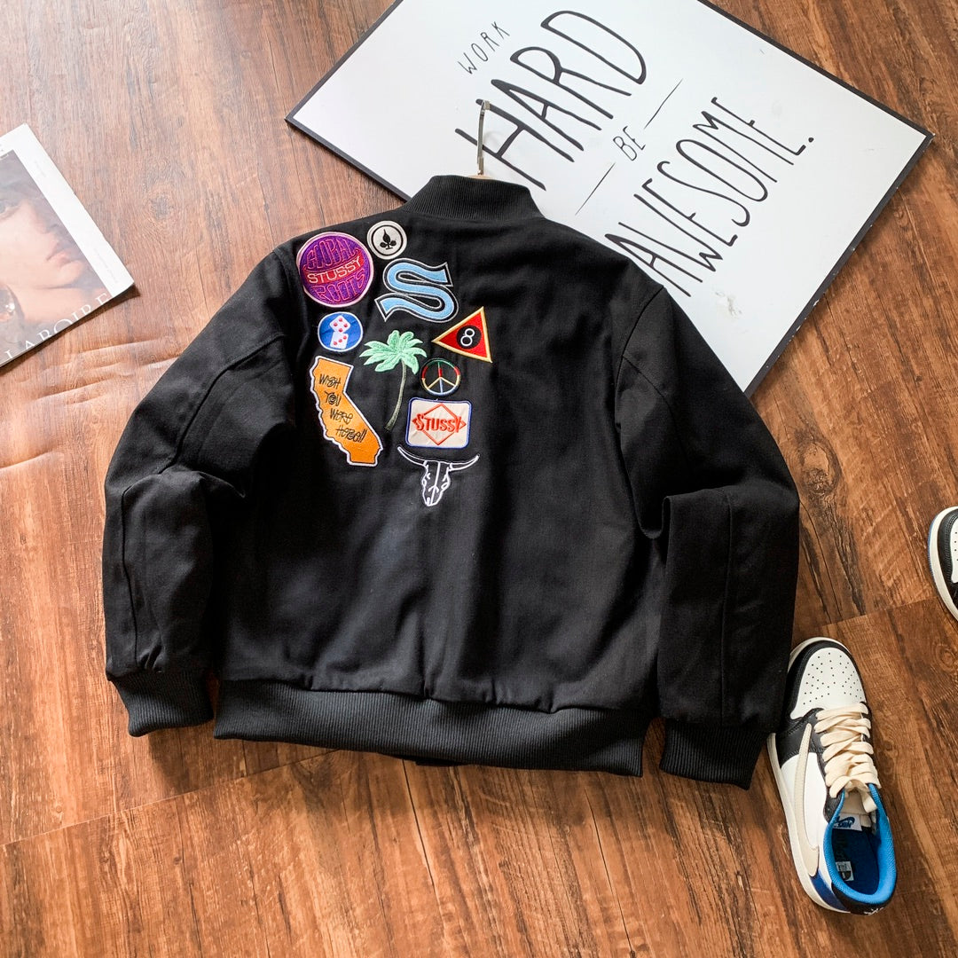 Black bomber jacket with colorful embroidered back patches