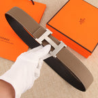 Hermes belt in textured brown leather with stitched edges and silver-tone H buckle