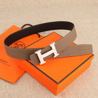 Hermes leather belt with brown strap and silver-tone H buckle, flat style with punched holes