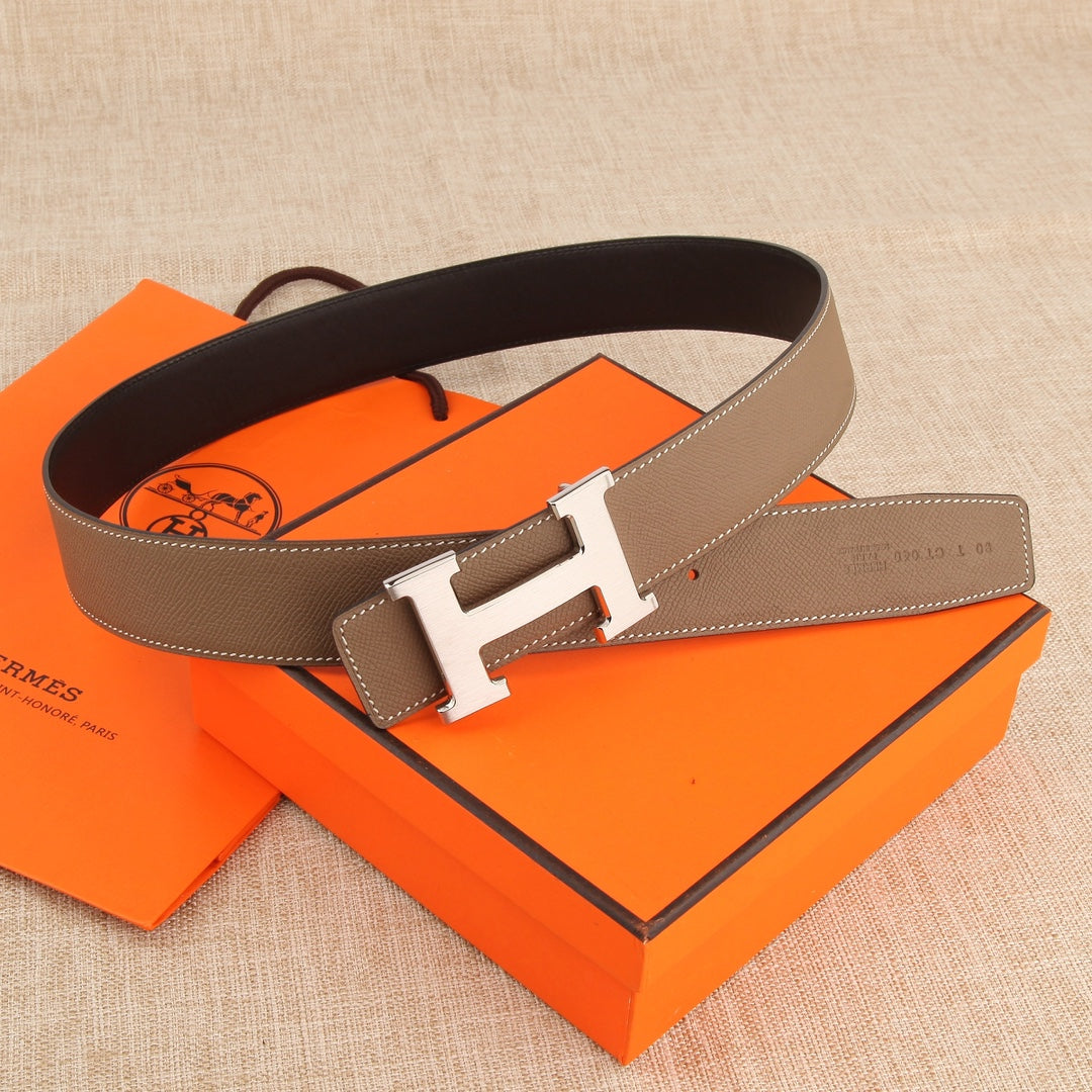 Hermes leather belt with brown strap and silver-tone H buckle, flat style with punched holes