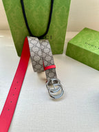 GG canvas belt with red leather edge and silver-tone double G buckle