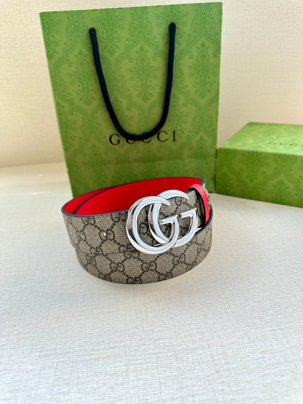 GG canvas belt with red leather trim and silver-tone interlocking G buckle