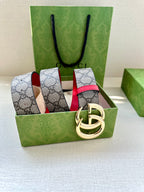 GG canvas belt with red leather center stripe and gold-tone interlocking G buckle