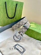Gucci belt close-up with GG canvas, blue strap, and silver-toned double G buckle