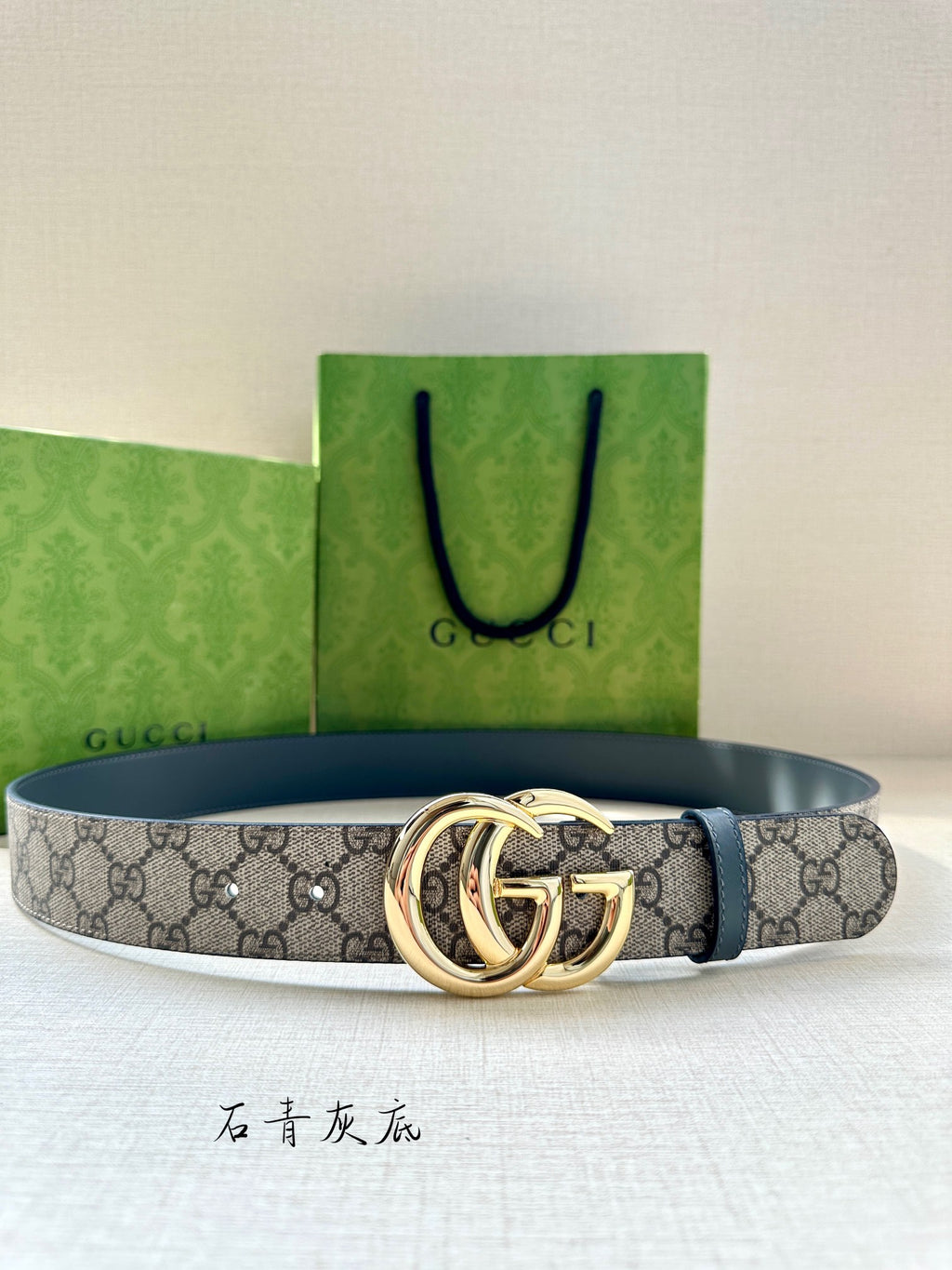 Gucci belt with GG canvas print, blue leather trim, and gold-tone double G buckle