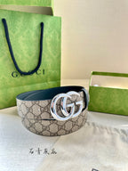 Gucci belt front view with GG canvas print, blue leather strap, and double G buckle