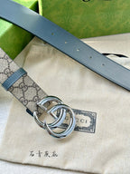 Gucci belt detail of blue leather strap with round grommets and silver-tone buckle ring