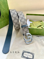 Gucci belt with GG canvas band, blue leather edge, and silver-tone double G buckle