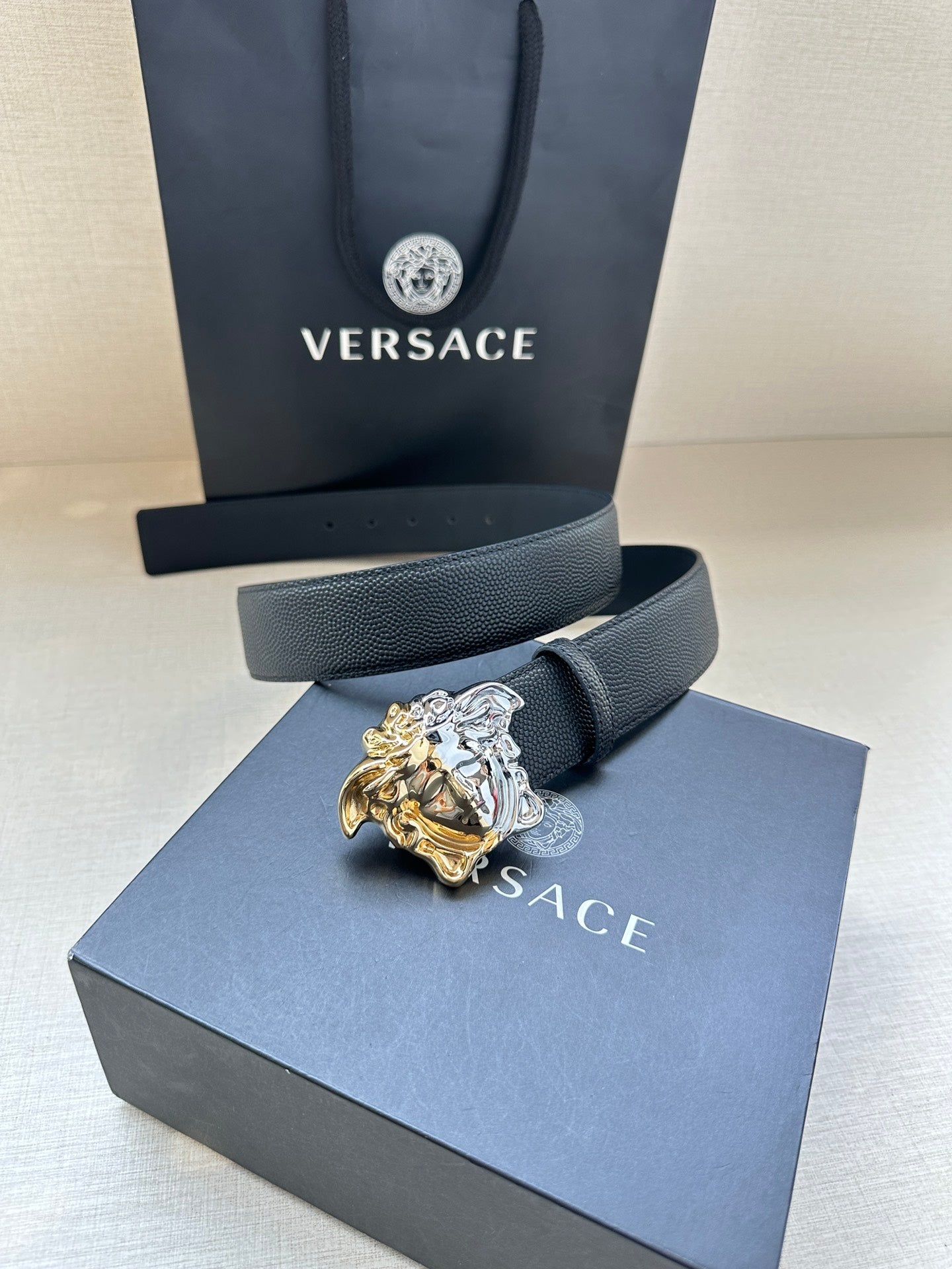Versace blue leather belt on box with Medusa crest gold and silver buckle