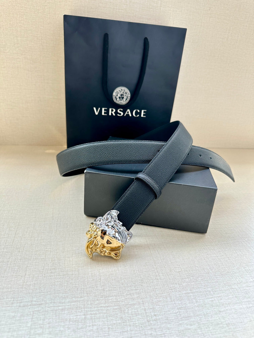 Versace blue leather belt with silver-and-gold Medusa crest buckle