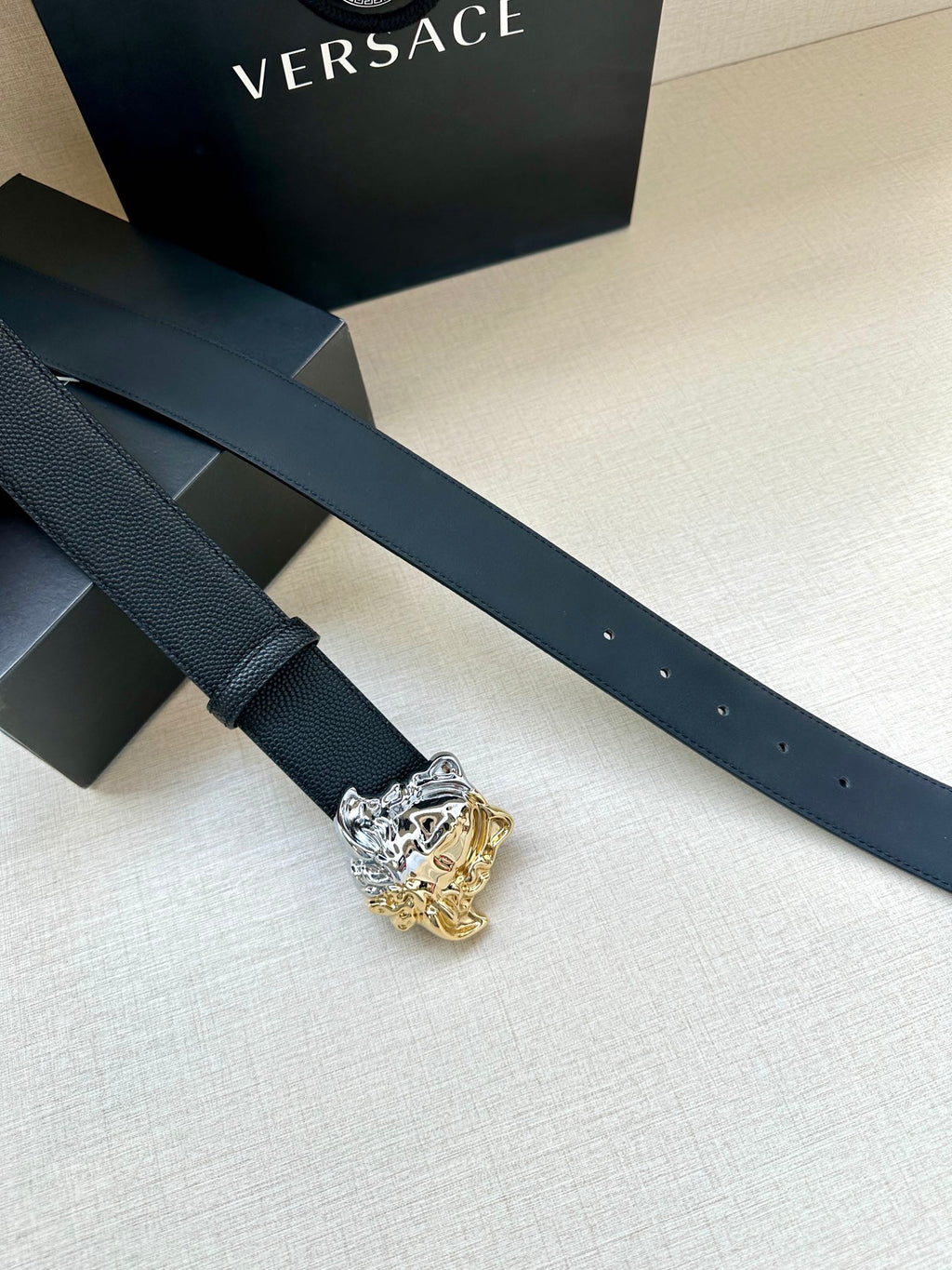 Versace blue leather belt with Medusa crest buckle and perforated strap holes