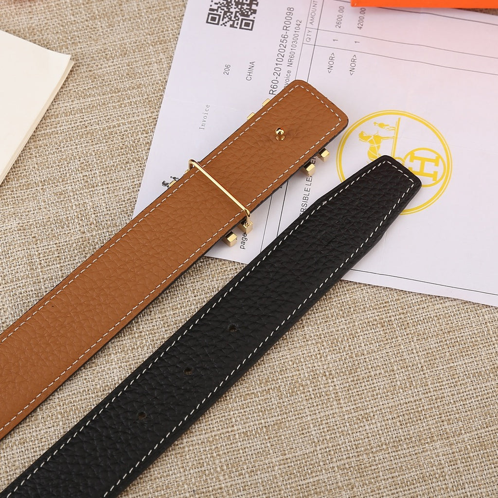 Two leather belts, black and tan, each with a gold-tone H buckle and stitching