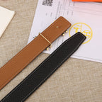 Two leather belts, black and tan, each with a gold-tone H buckle and stitching