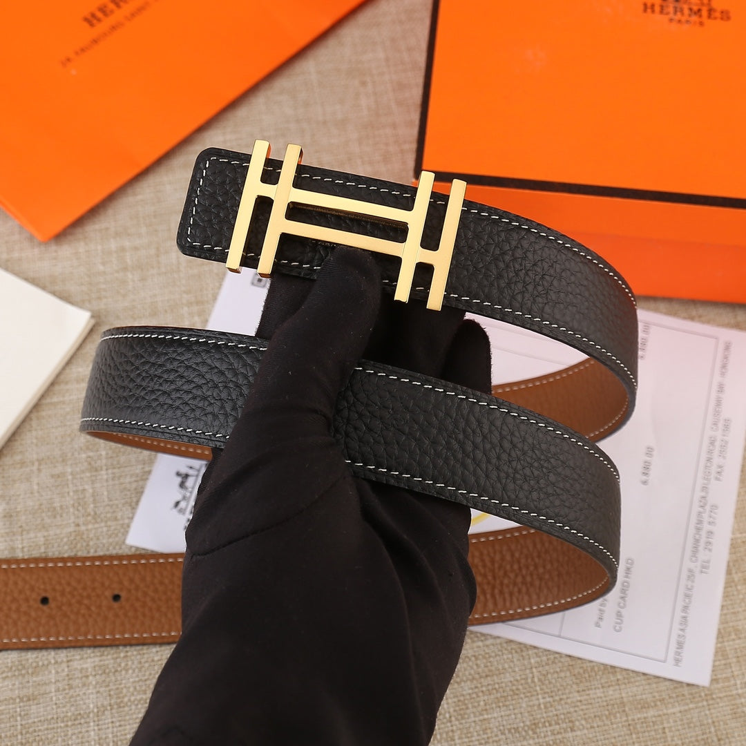 Black leather belt with gold-tone H buckle and contrast white stitching