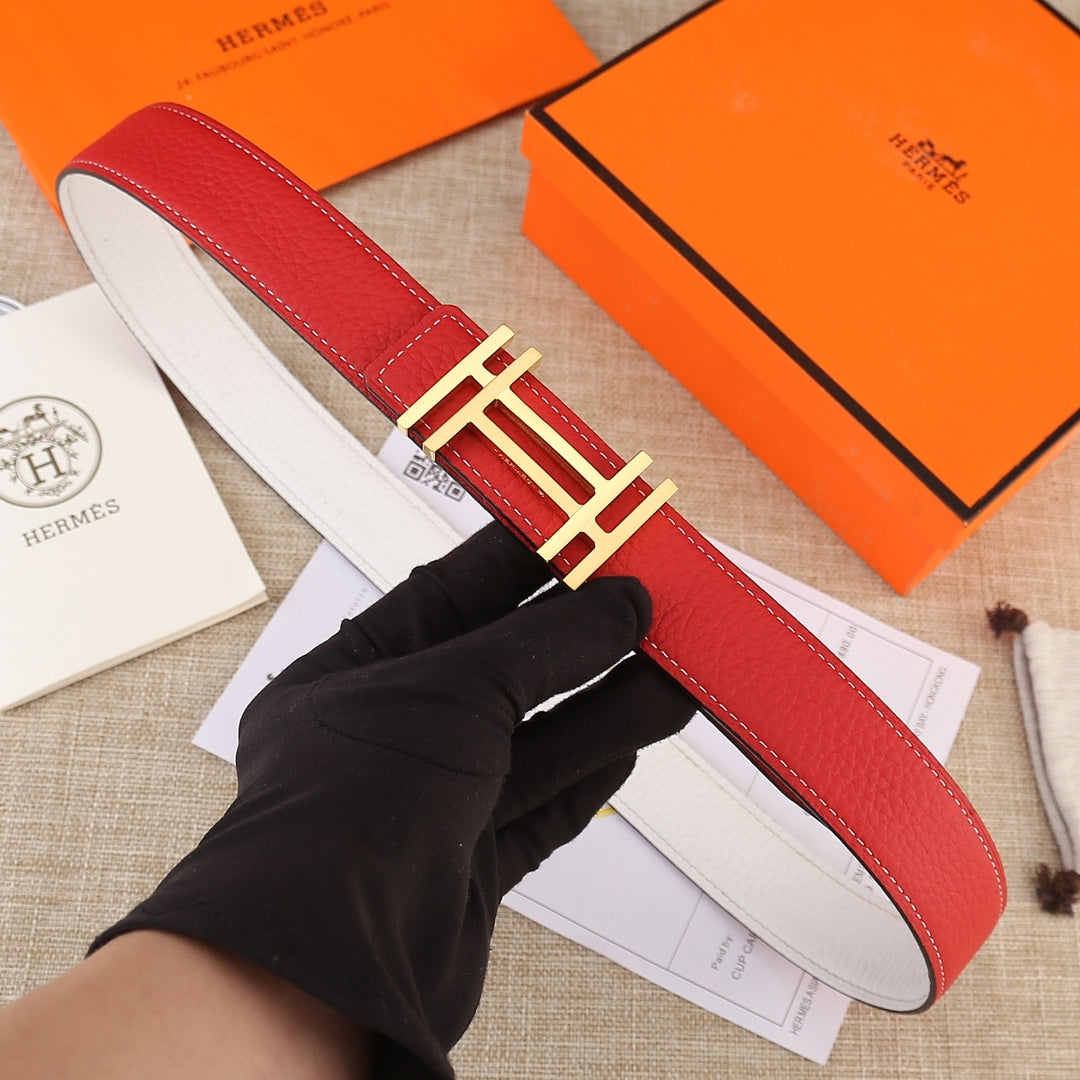 Red leather belt with gold H-style buckle and white contrast stitching.