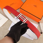 Red leather belt with gold H buckle and white contrast stitching, full strap view.