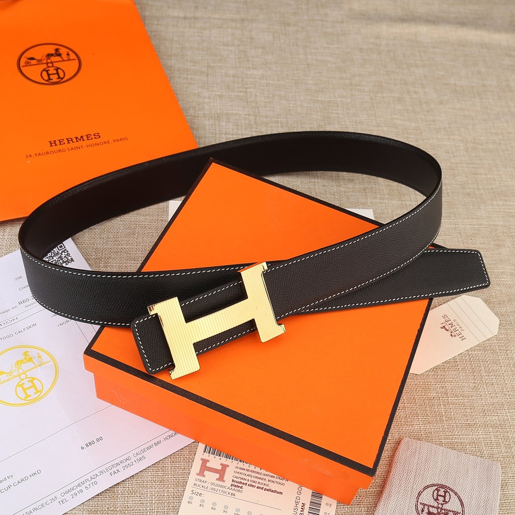 Black leather belt loop with gold H buckle and contrast white topstitching